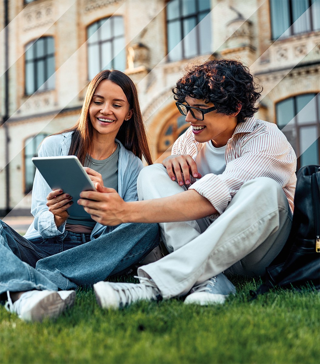 University students collaborating with a tablet outside a Roman building
